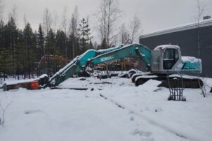 Kobelco SK210LC + Rammer